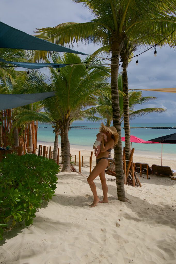Beach with palm trees at Rosewood Mayakoba