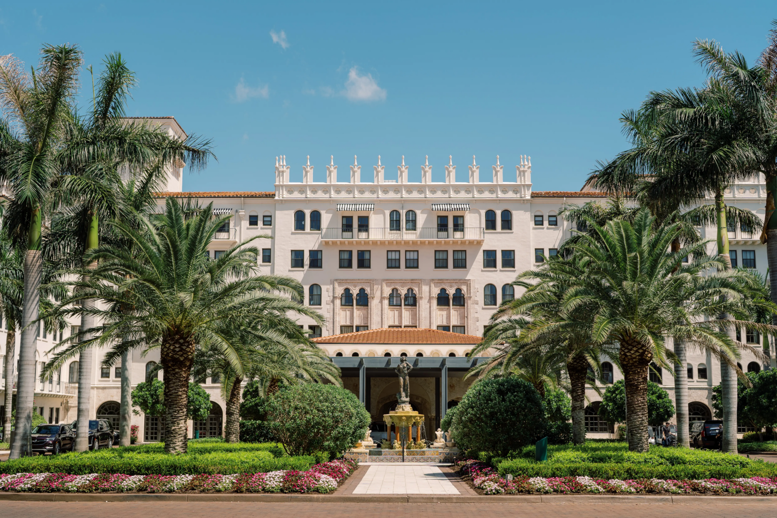 The Cloister at The Boca Raton exterior with palm trees and fountain