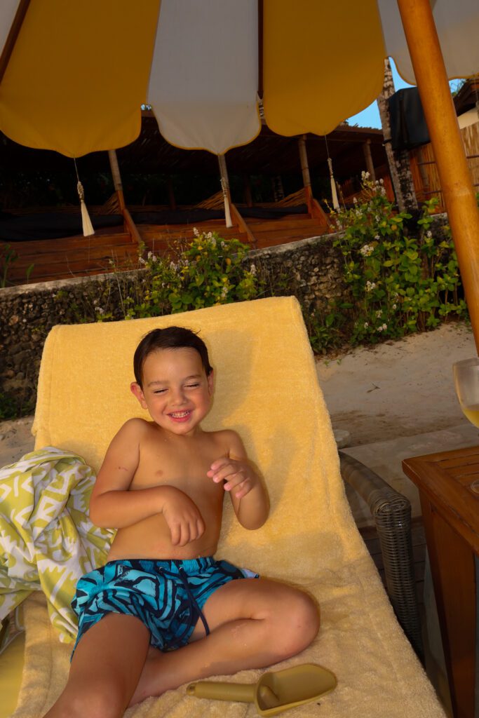 Toddler son relaxing on a lounger at NIHI Sumba