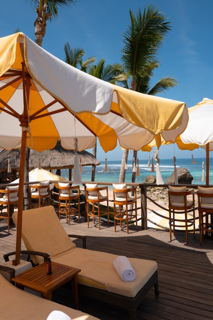 Beachfront umbrellas and loungers at NIHI Sumba